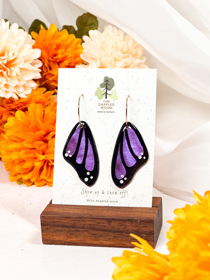 Purple butterfly wing earrings from The Dappled Wood, a bold and artistic nature-inspired statement piece.