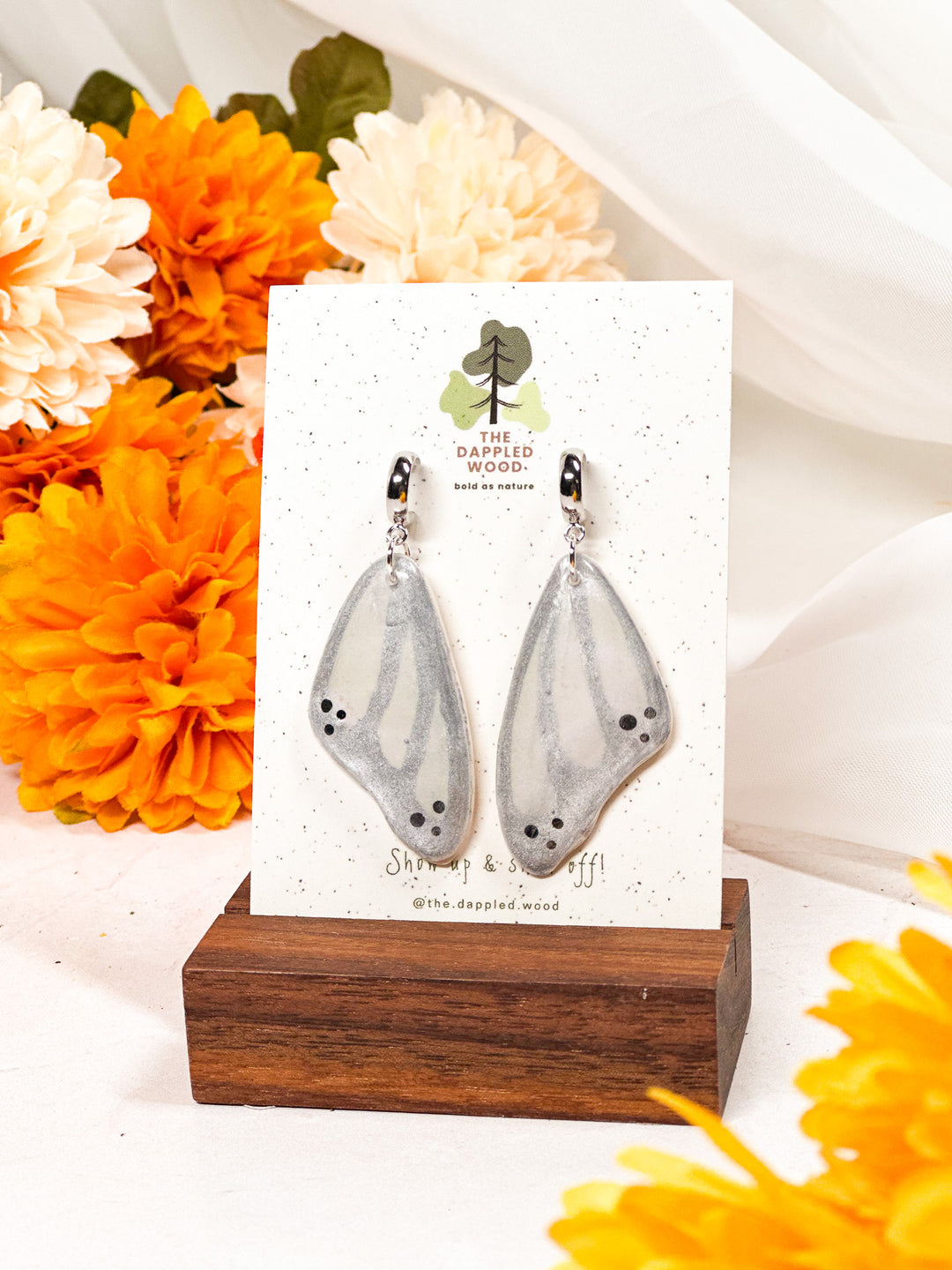 Silver butterfly wing earrings from The Dappled Wood, lightweight and hypoallergenic nature-inspired jewelry.