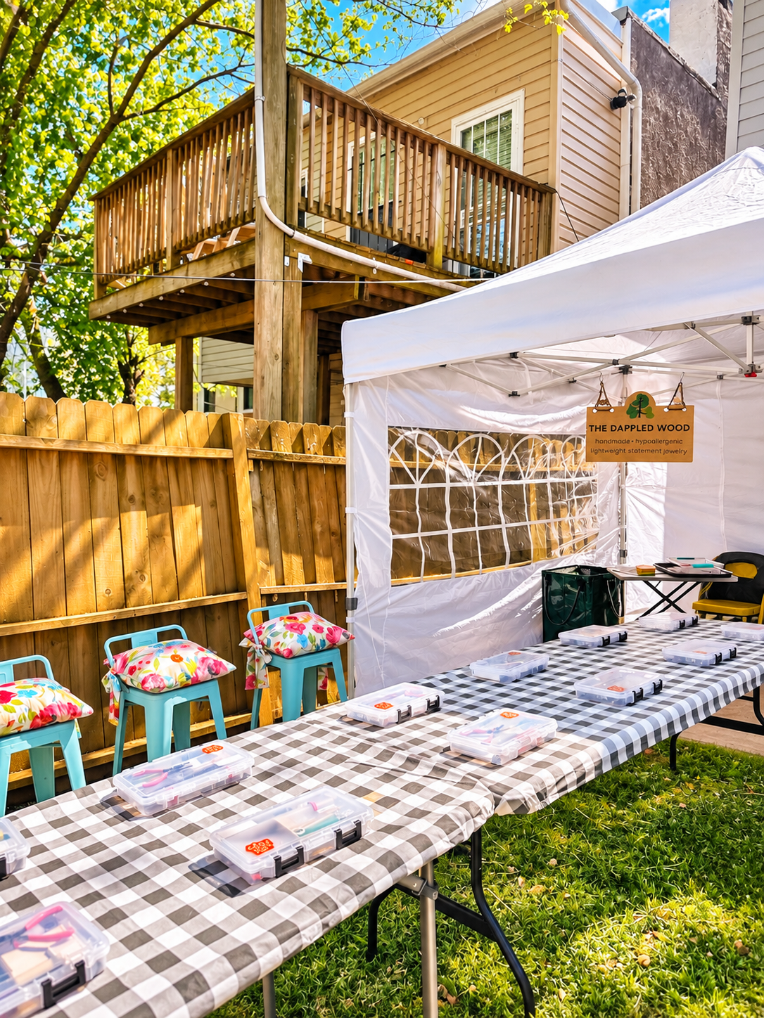 Outdoor workshop seating and tool kits ready for guests under a canopy