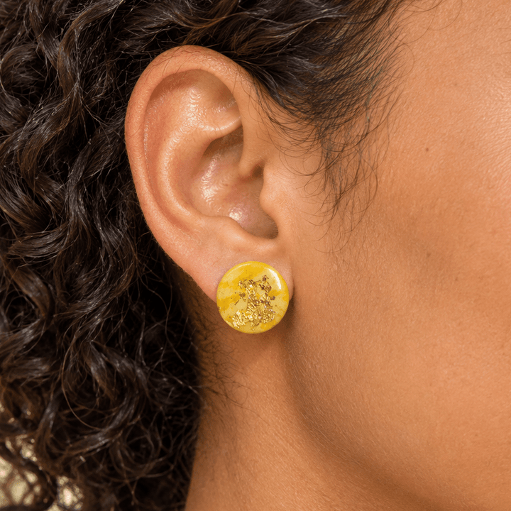 AI-generated styling preview of the Zinnia circle stud; scale is illustrative