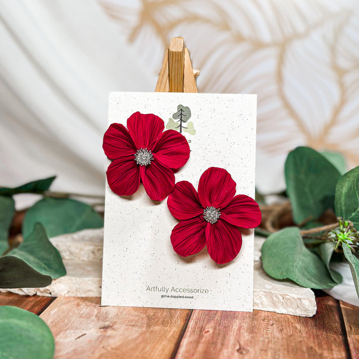 The Dappled Wood Frosted Petals handsculpted winter floral earrings in cherry with silver findings from the New Year 2025 collection