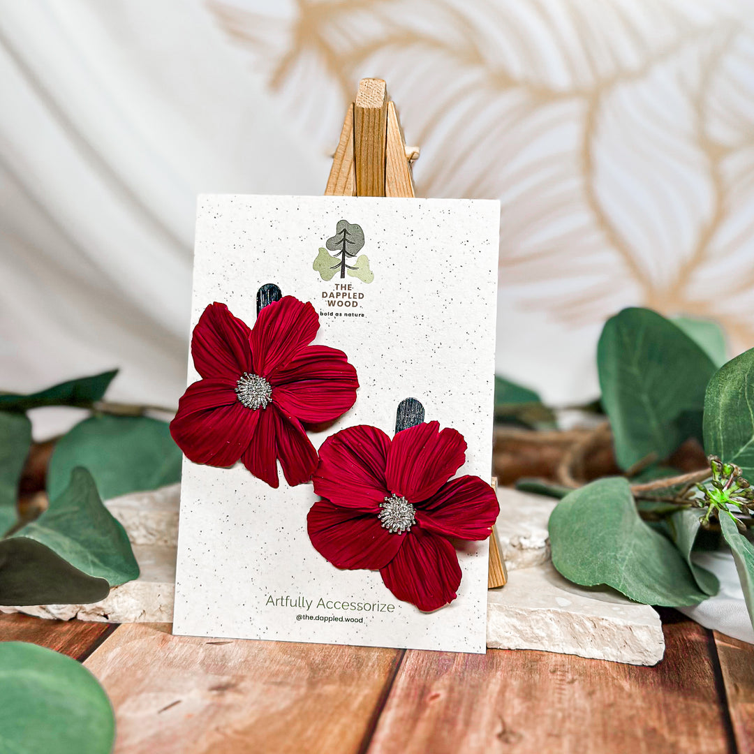 The Dappled Wood Frosted Petals handsculpted winter floral earrings in cherry featuring a brushed silver post from the New Year 2025 collection.