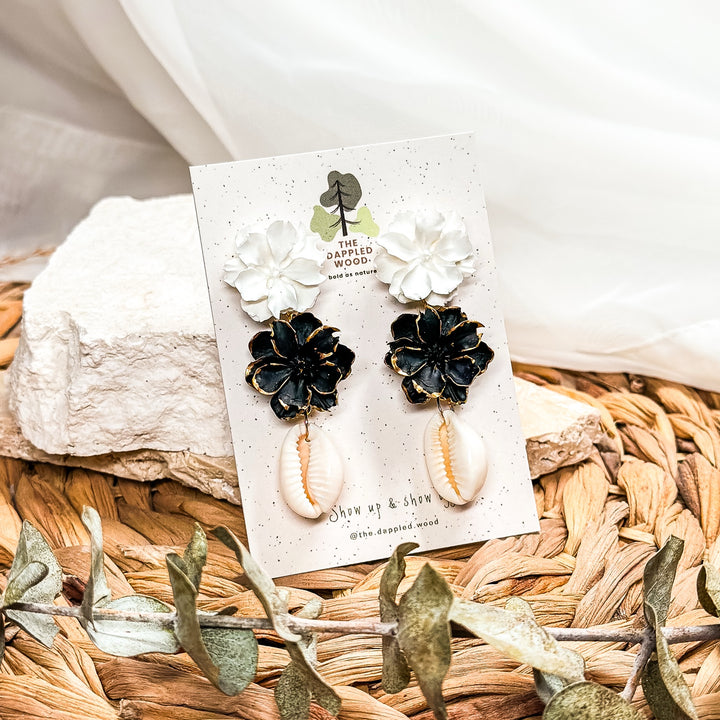 Zuri stacked black and white flower earrings with real cowrie shells by The Dappled Wood.